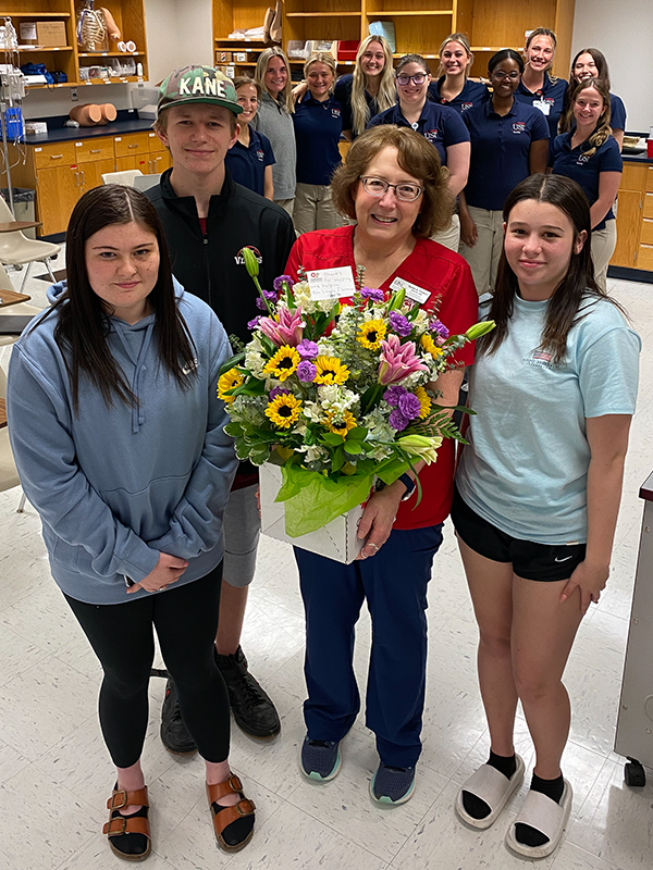 Photo of Susan Seibert with visitors