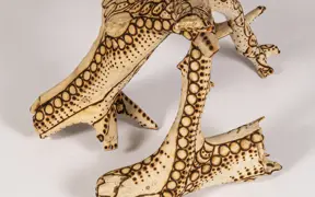 tattooed wood art piece