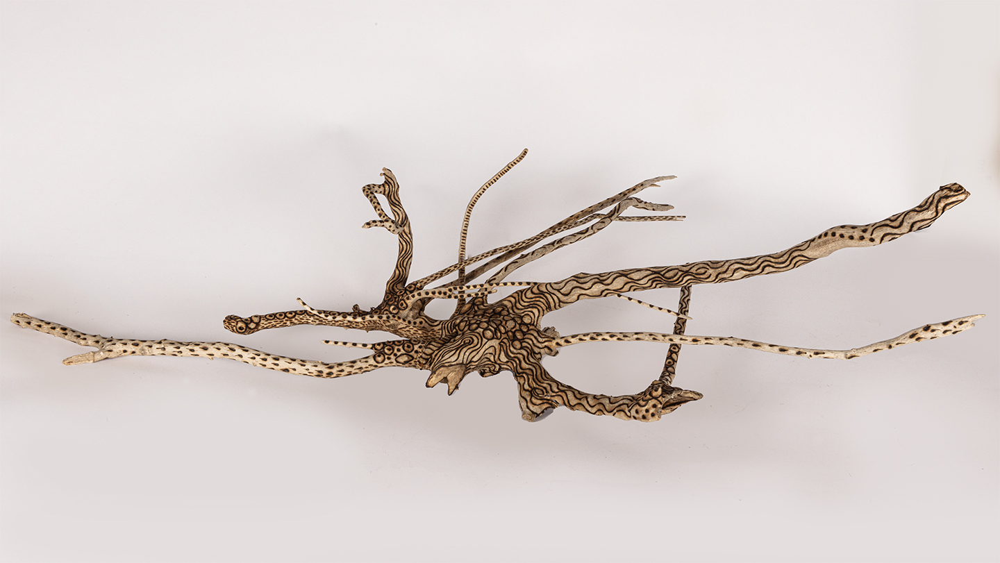 tattooed wood art piece