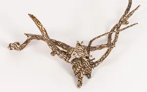 tattooed wood art piece