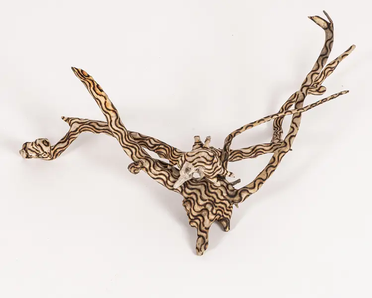 tattooed wood art piece