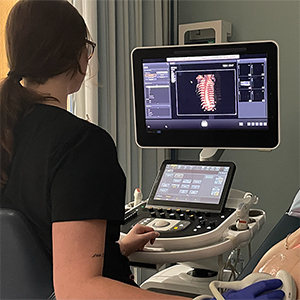 Phot of student using sonography machine