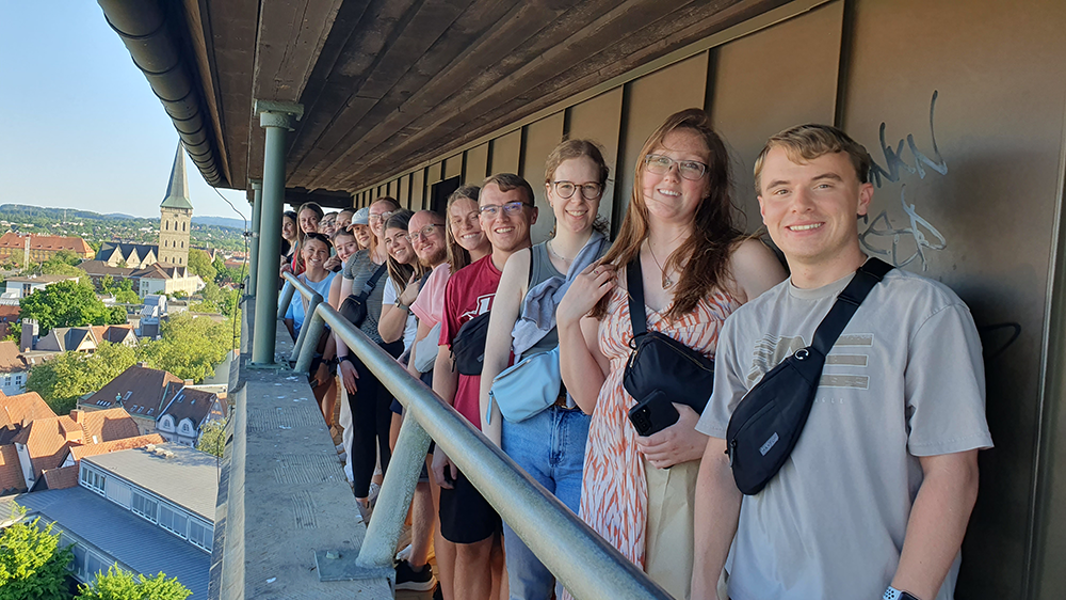 Students pose for photo on balcony in Germany