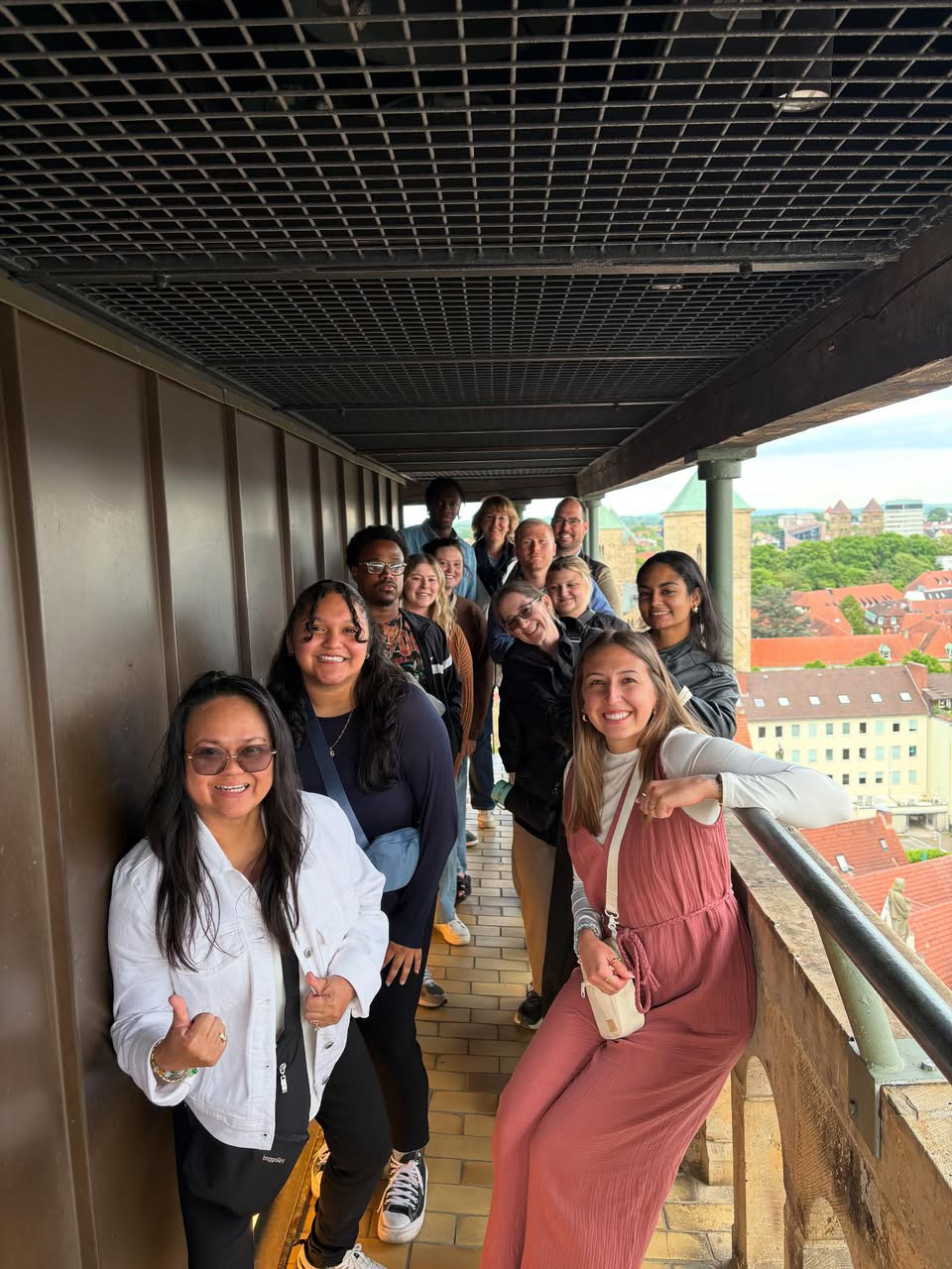 Students atop a tall bell tower 