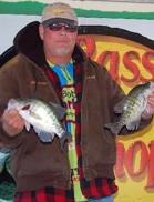 Jim Dant holding two fish