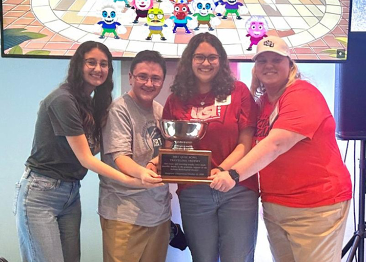 Students with Quiz Bowl Trophy