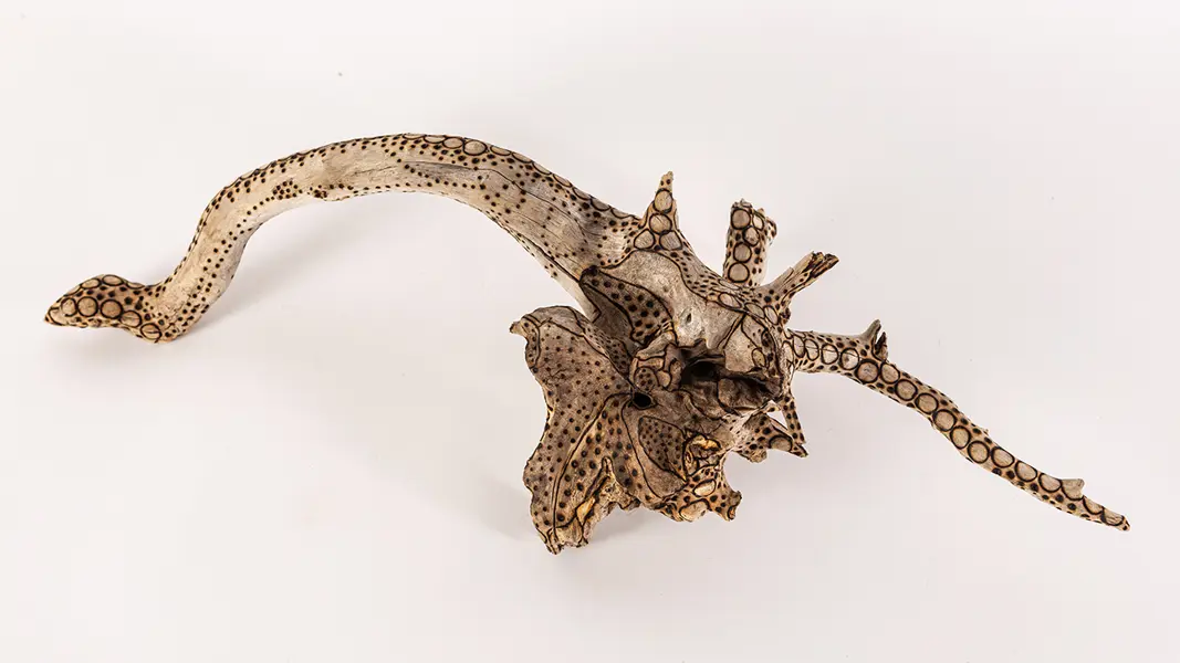 tattooed wood art piece