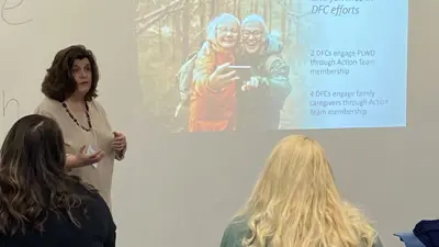 A woman gives a presentation on dementia-friendly communities