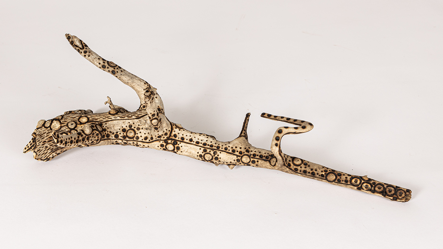 tattooed wood art piece