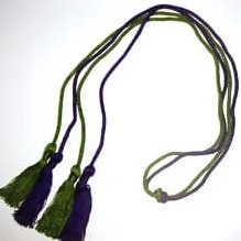 forest green cord and maroon cord knotted together with knots and tassels at each end of the cords