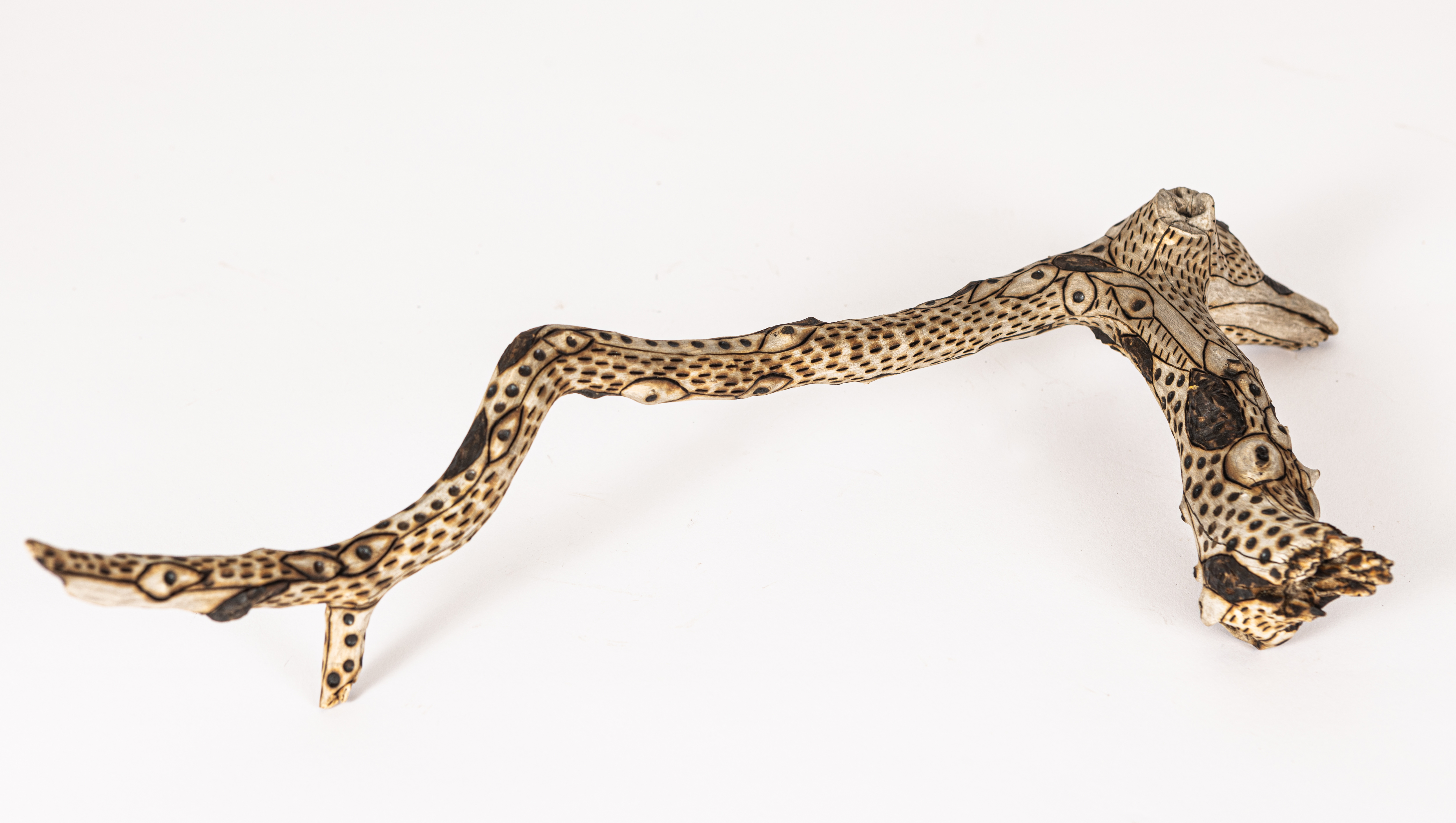 tattooed wood art piece