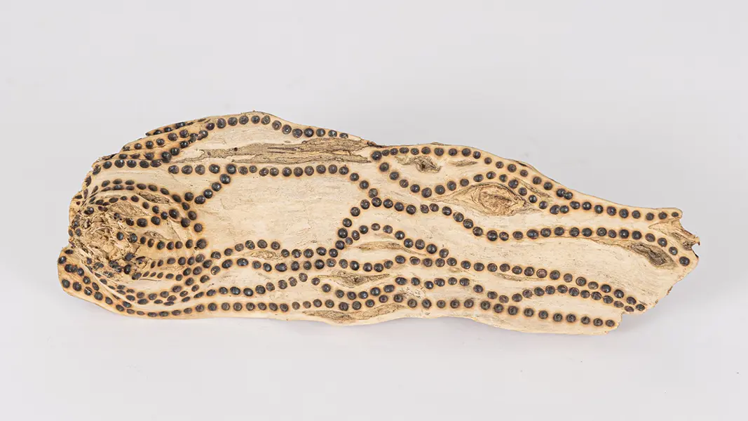 tattooed wood art piece