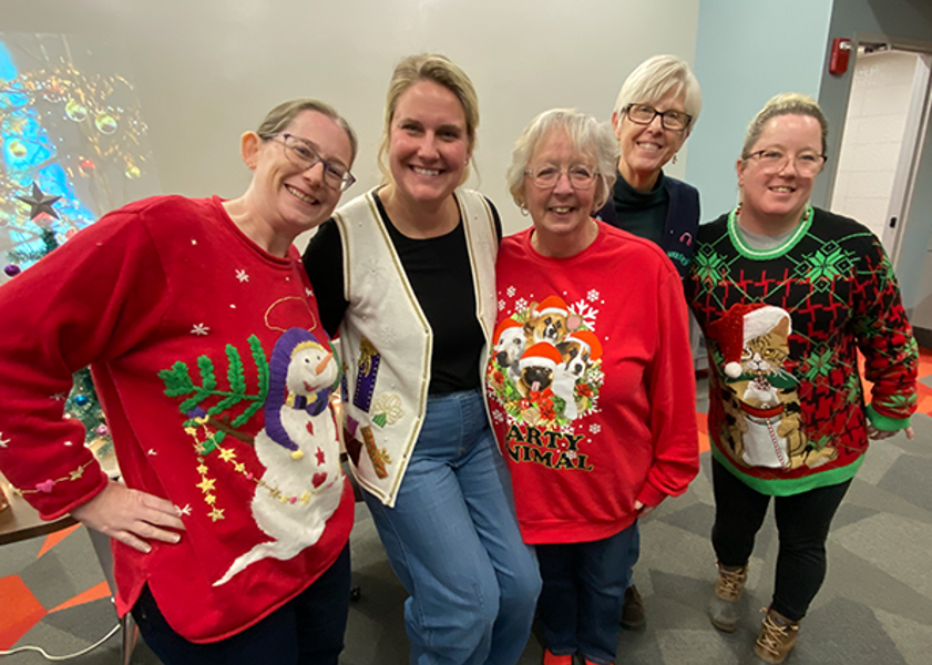 Kinney College staff and faculty wearing holiday attire