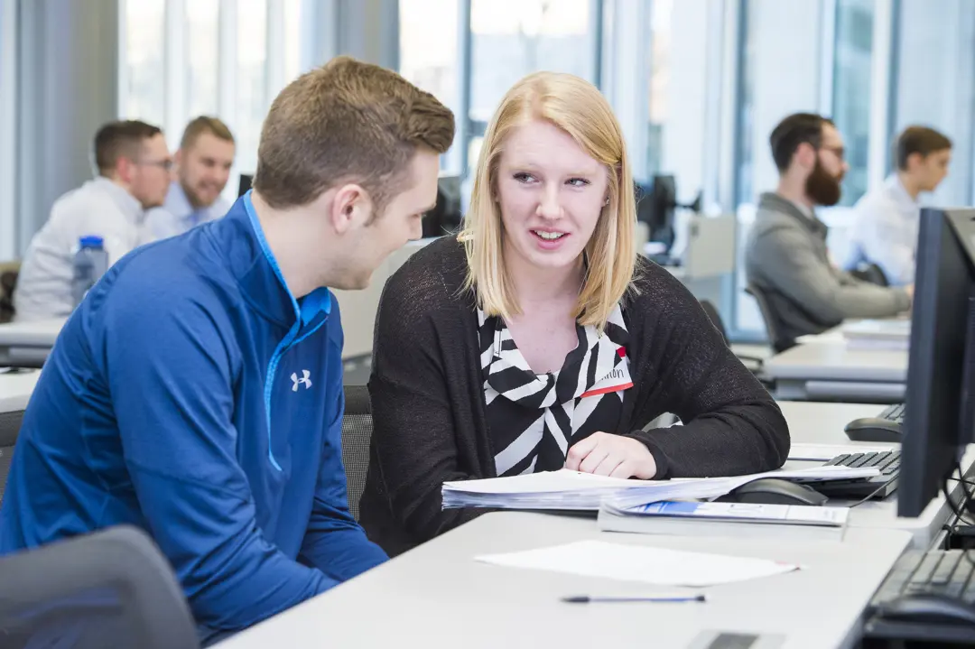 Finance student works with a community member to prepare annual taxes