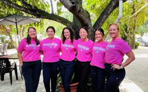 Students and faculty wearing pink USI shirts