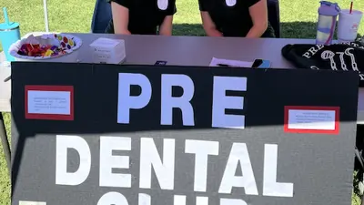 Pre-Dental Club members table at a student involvement fair