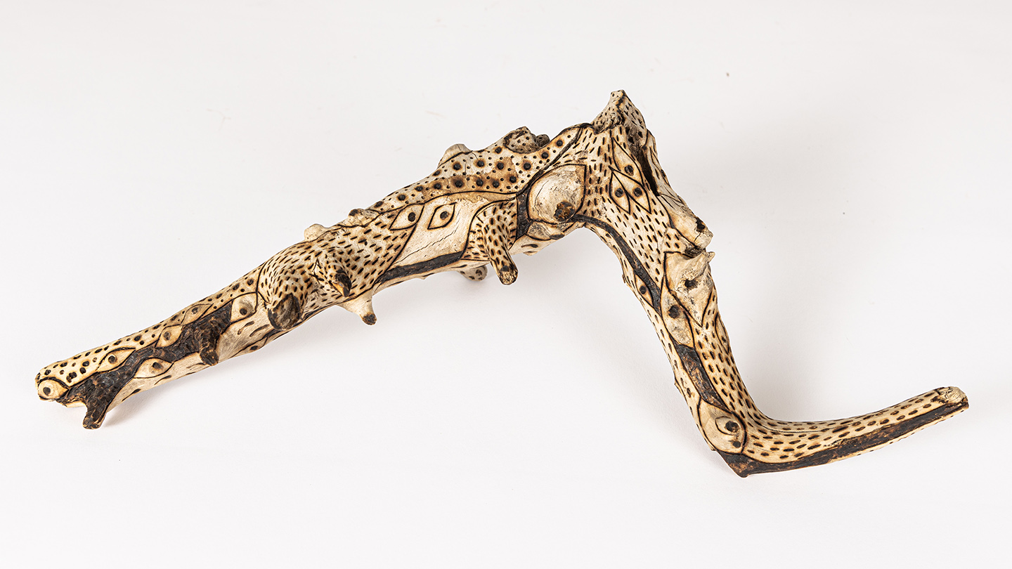 tattooed wood art piece