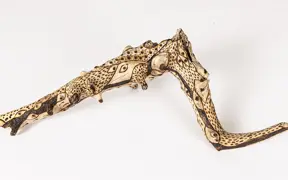 tattooed wood art piece