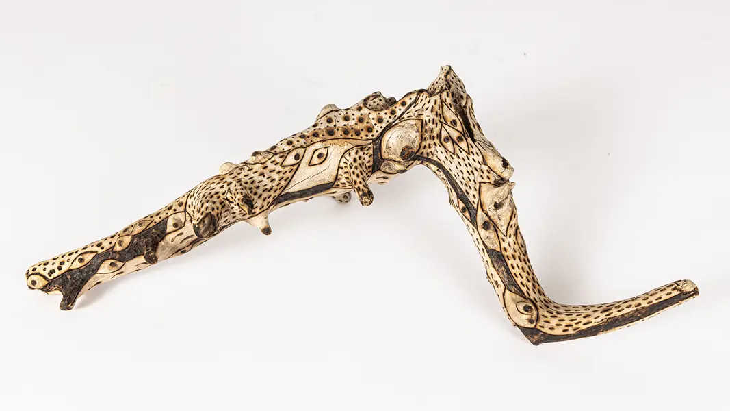 tattooed wood art piece