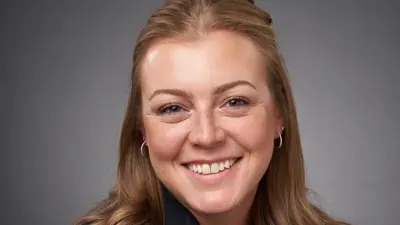 Professional portrait of USI criminal justice alumna Taylor Merriss