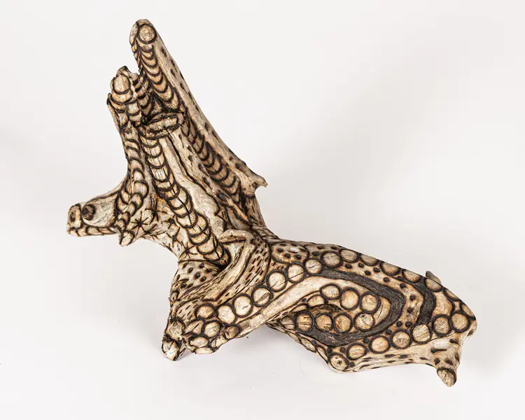 tattooed wood art piece