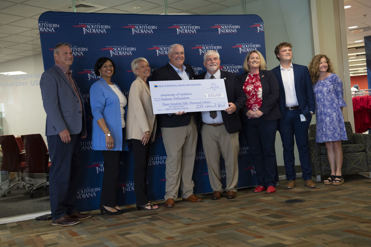USI and Old National Bank representatives pose for a photo with a $350,000 grant from Old National Bank.