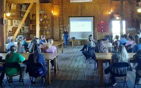 Students attend an interactive classroom presentation during a career and agricultural education program.