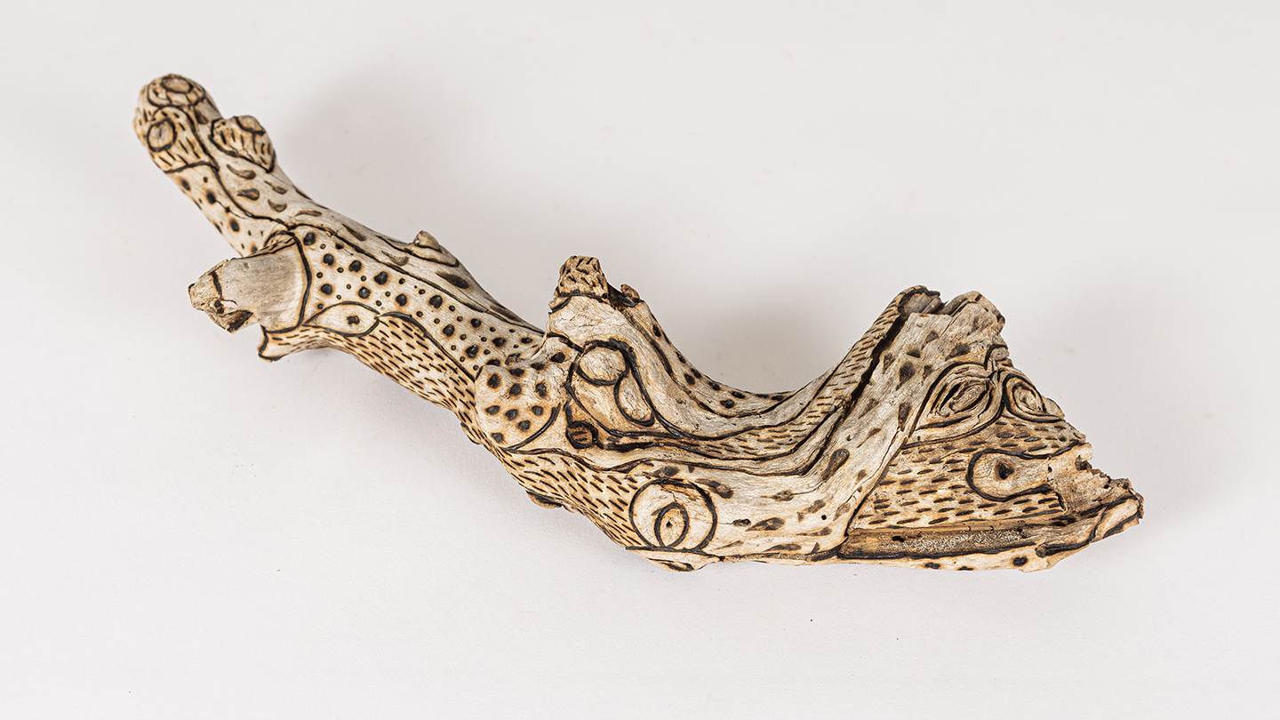 tattooed wood art piece