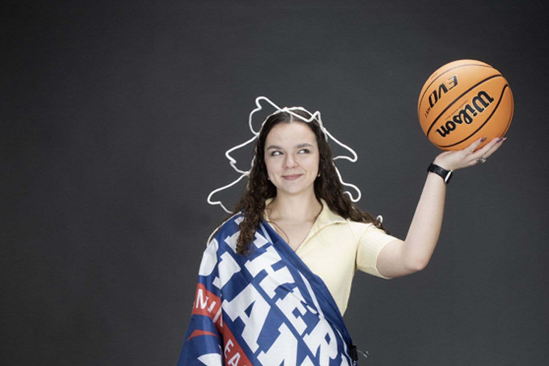 A member of the homecoming court is decked out like the Statue of Liberty using props from the photo studio for one of her homecoming photos. 