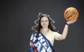 A member of the homecoming court is decked out like the Statue of Liberty using props from the photo studio for one of her homecoming photos. 