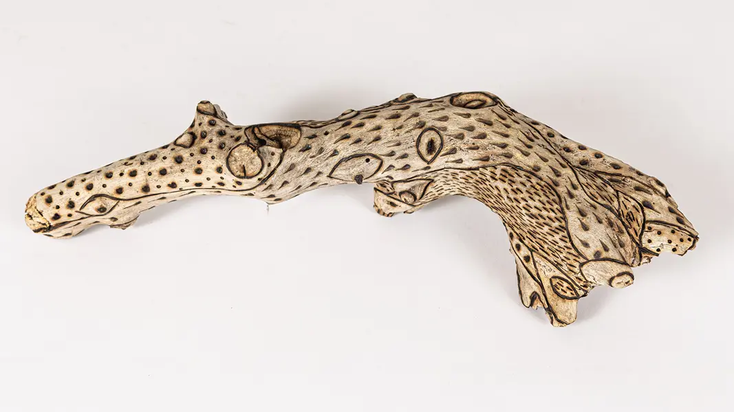 tattooed wood art piece