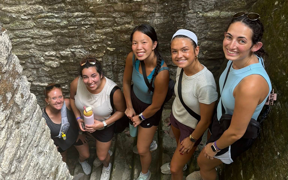 OT students and faculty hiking on stone steps