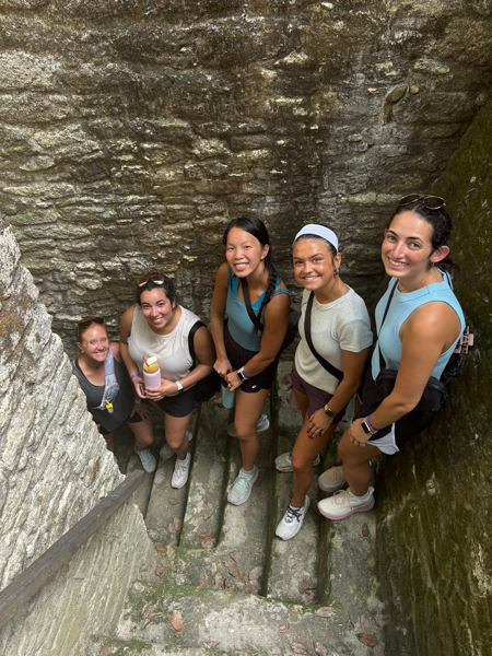 OT students and faculty hiking on stone steps