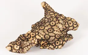 tattooed wood art piece