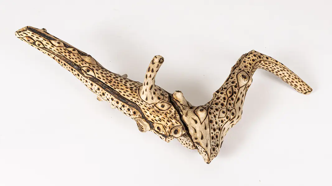 tattooed wood art piece