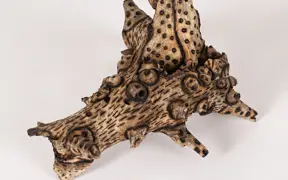 tattooed wood art piece