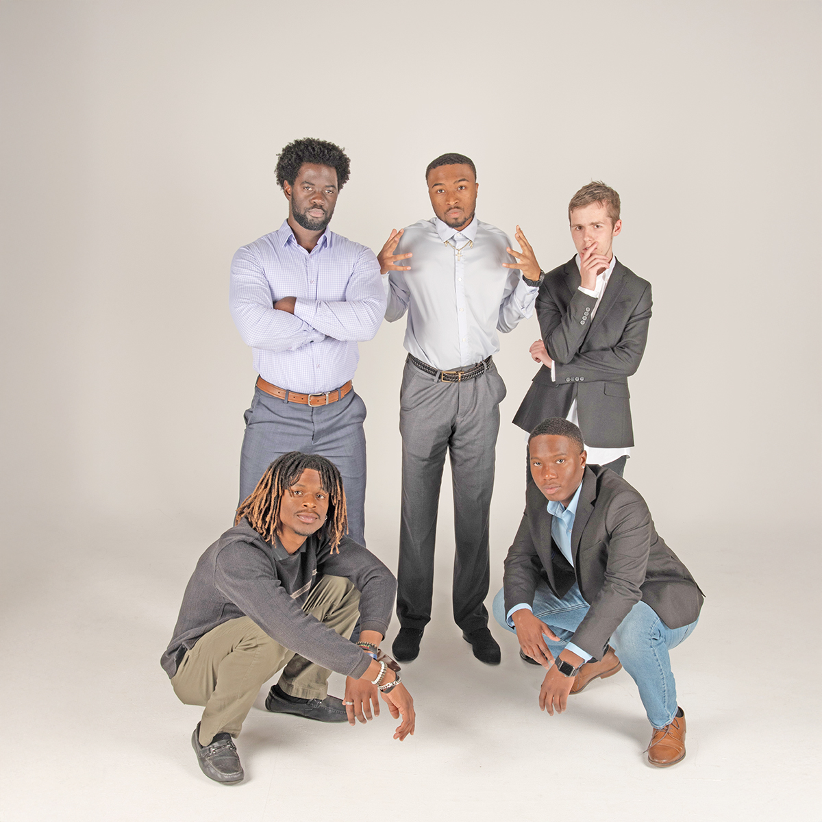 Members of the Collegiate Men of Distinction strike a pose in the photo studio
