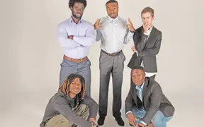 Members of the Collegiate Men of Distinction strike a pose in the photo studio