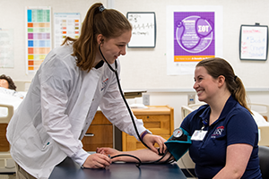 Two nursing students in skills lab