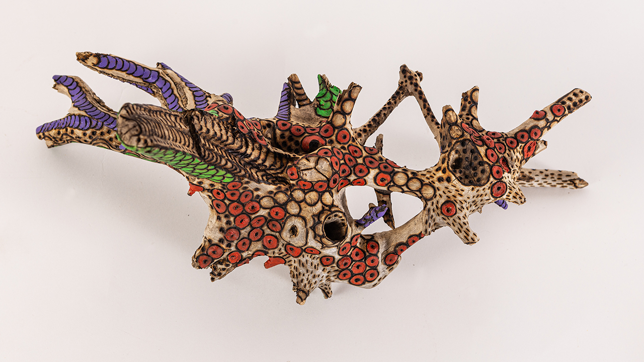 tattooed wood art piece