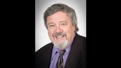 Professional portrait of Dr. Wayne Rinks, associate professor emeritus of Communications