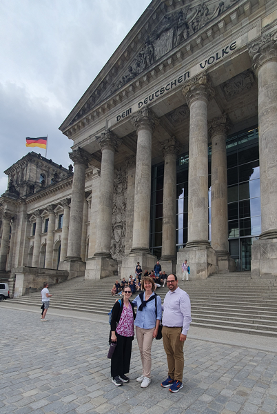 Faculty members in front of an ancient German building