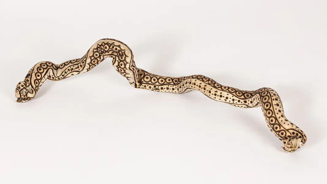 tattooed wood art piece
