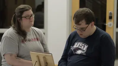 Photo of Lucas, who has communication challenges due to autism, with his communication regulation partner