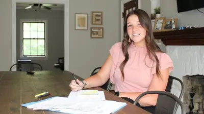 Photo of a woman at a desk in an office
