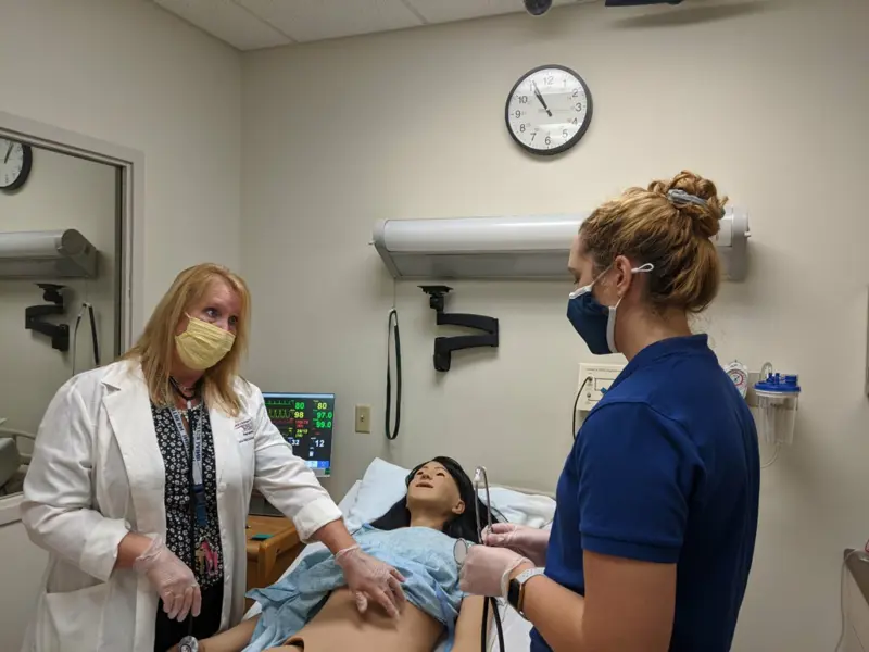 Nutrition students use the clinical simulation center during a class