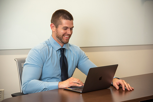 Photo of health professional using laptop