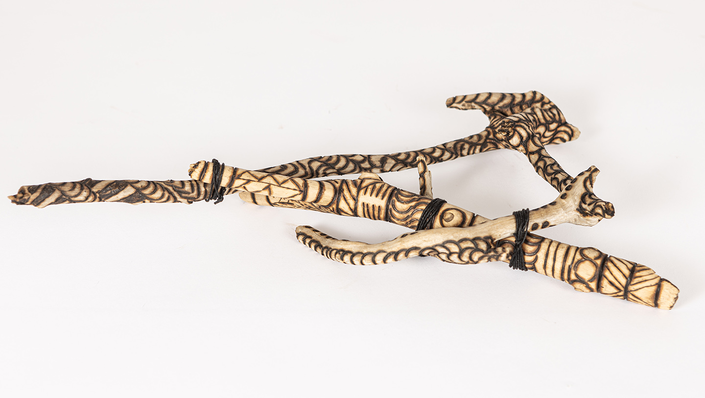 tattooed wood art piece