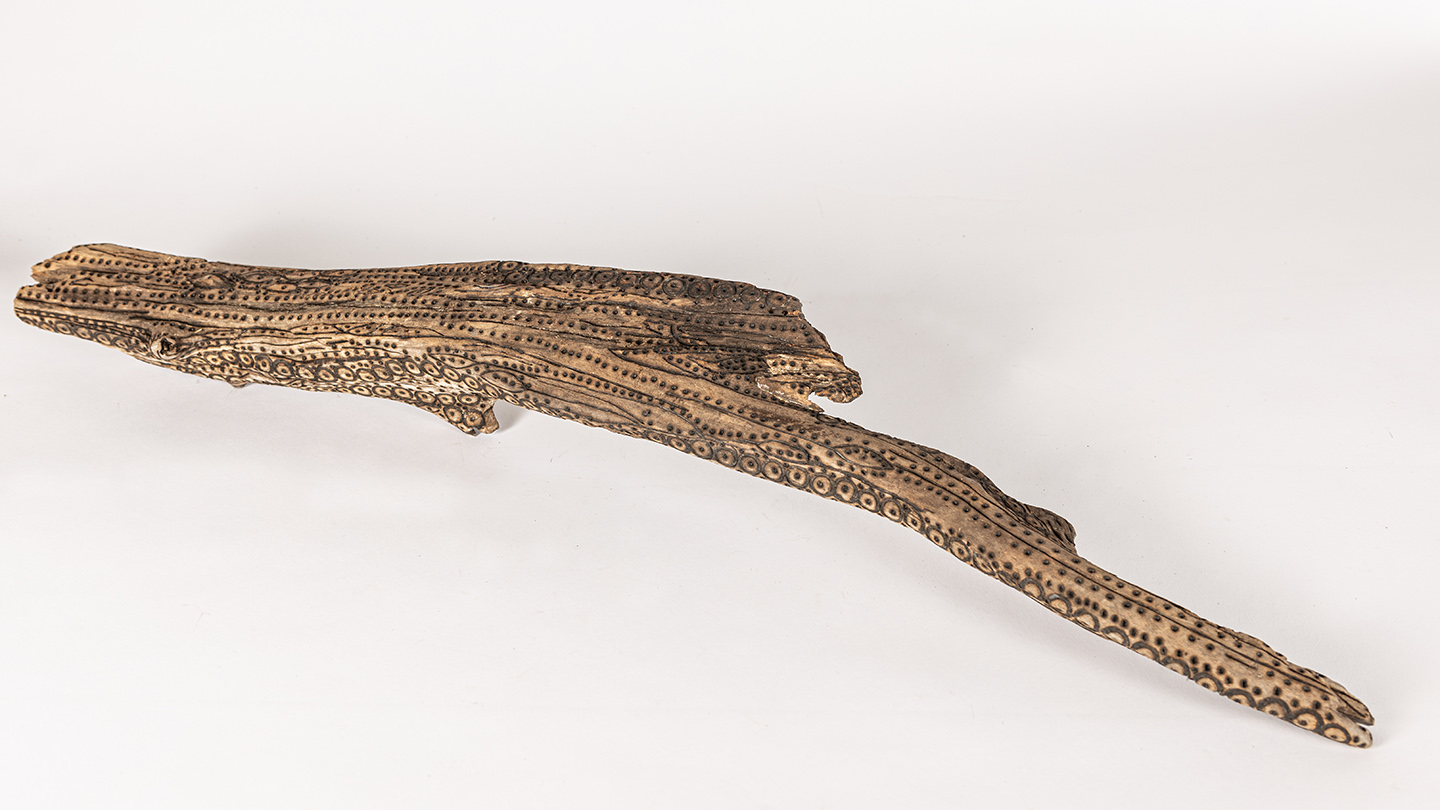 tattooed wood art piece