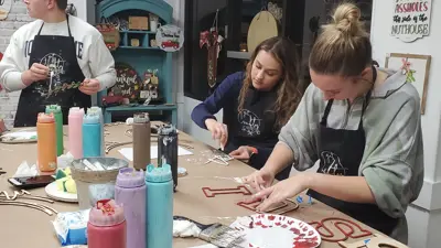 Pott College students craft holiday decorations with paint and wood